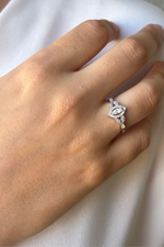 Natural pearl jewelry set ring displayed on a hand with a light background showcasing its elegant design.