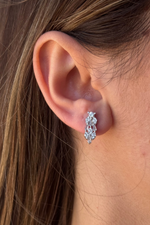 Elegant earrings on display, showcasing intricate design and sparkling details, perfect for any occasion.